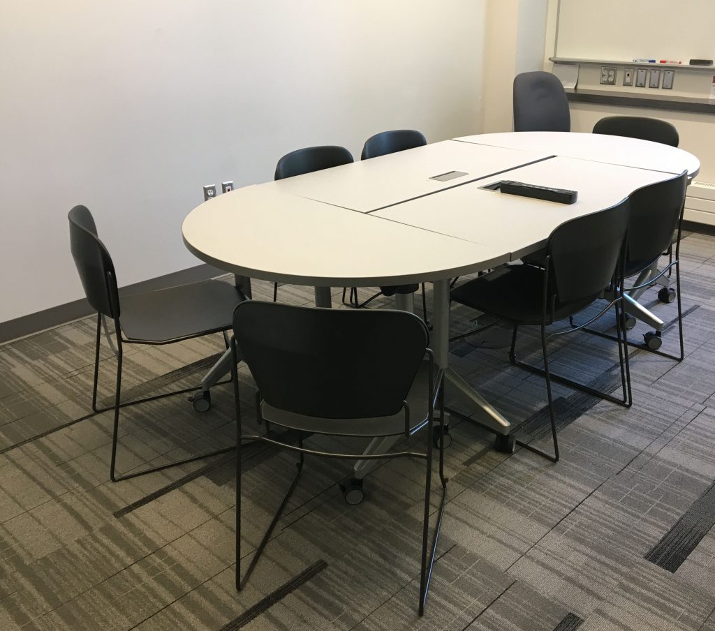 two rectangular tables and two half circle tables grouped together