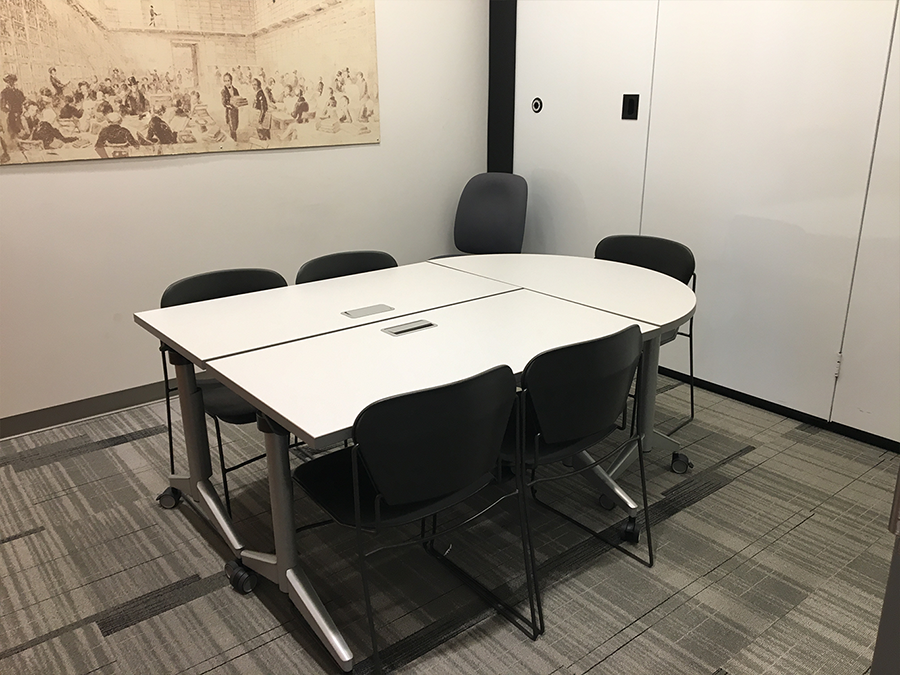 two rectangular tables and a half circle table grouped together