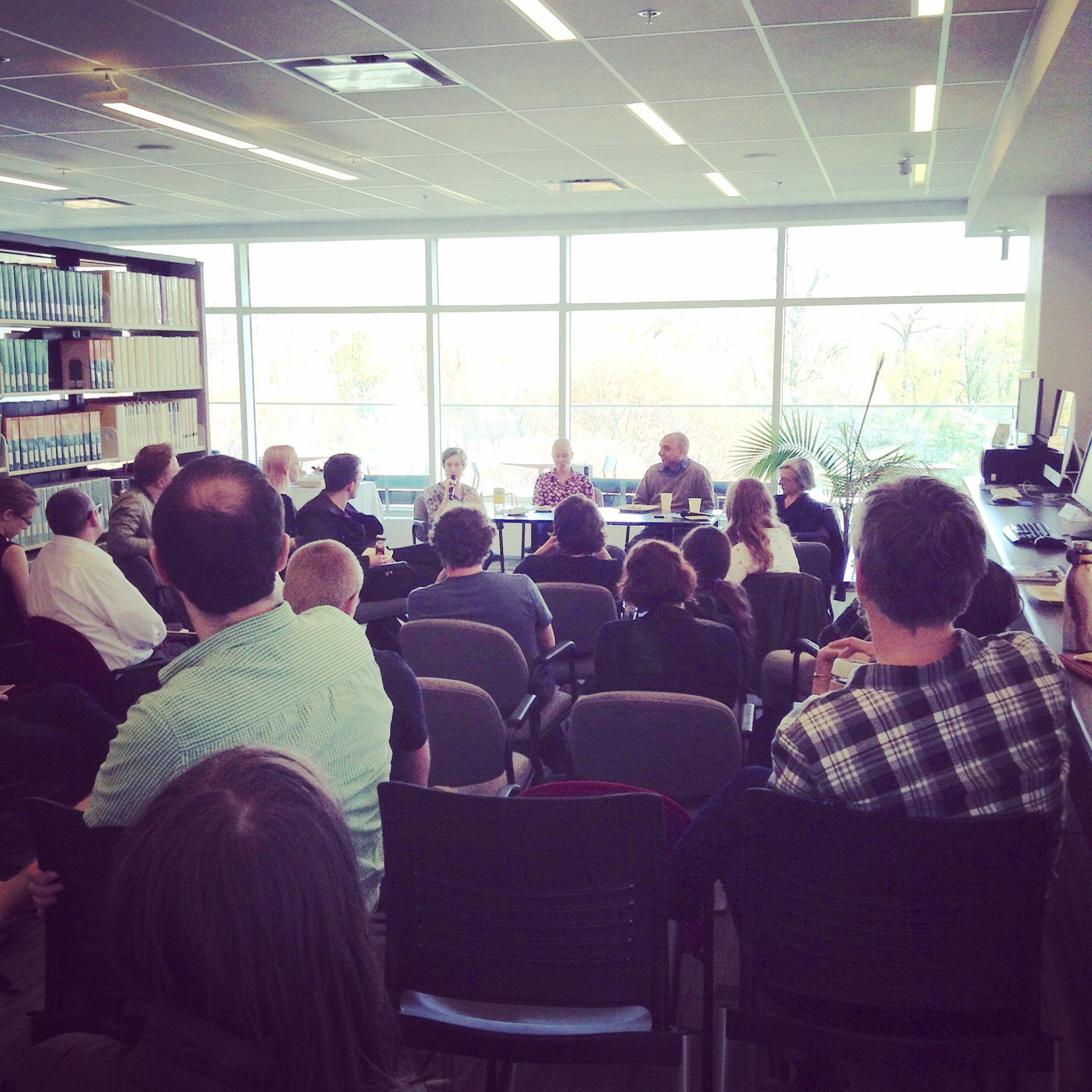 group of people listening to a presenter