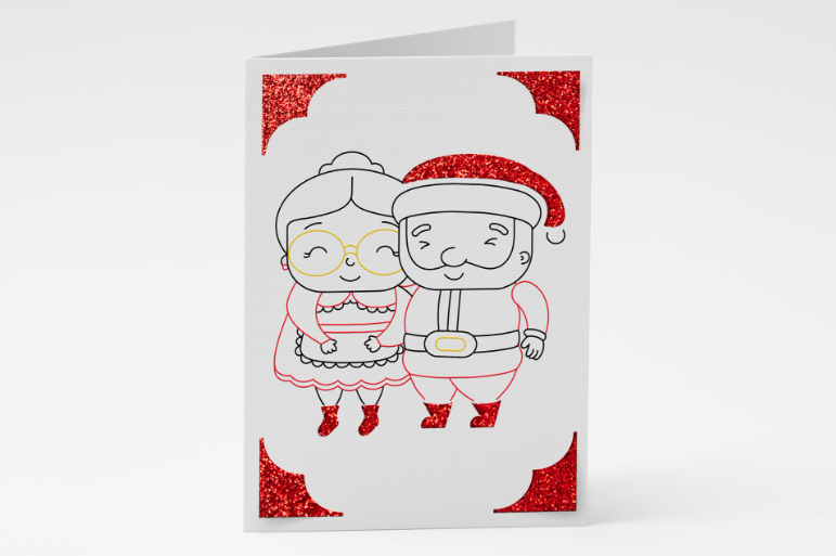 Red and white card with a cute drawing of Mr. and Mrs. Claus