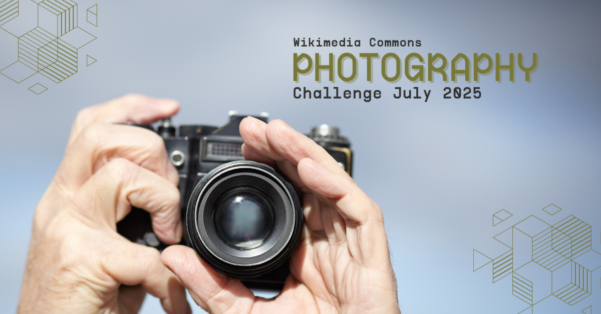 Image with hands holding camera and the text "Wikimedia Photography Challenge July 2025."