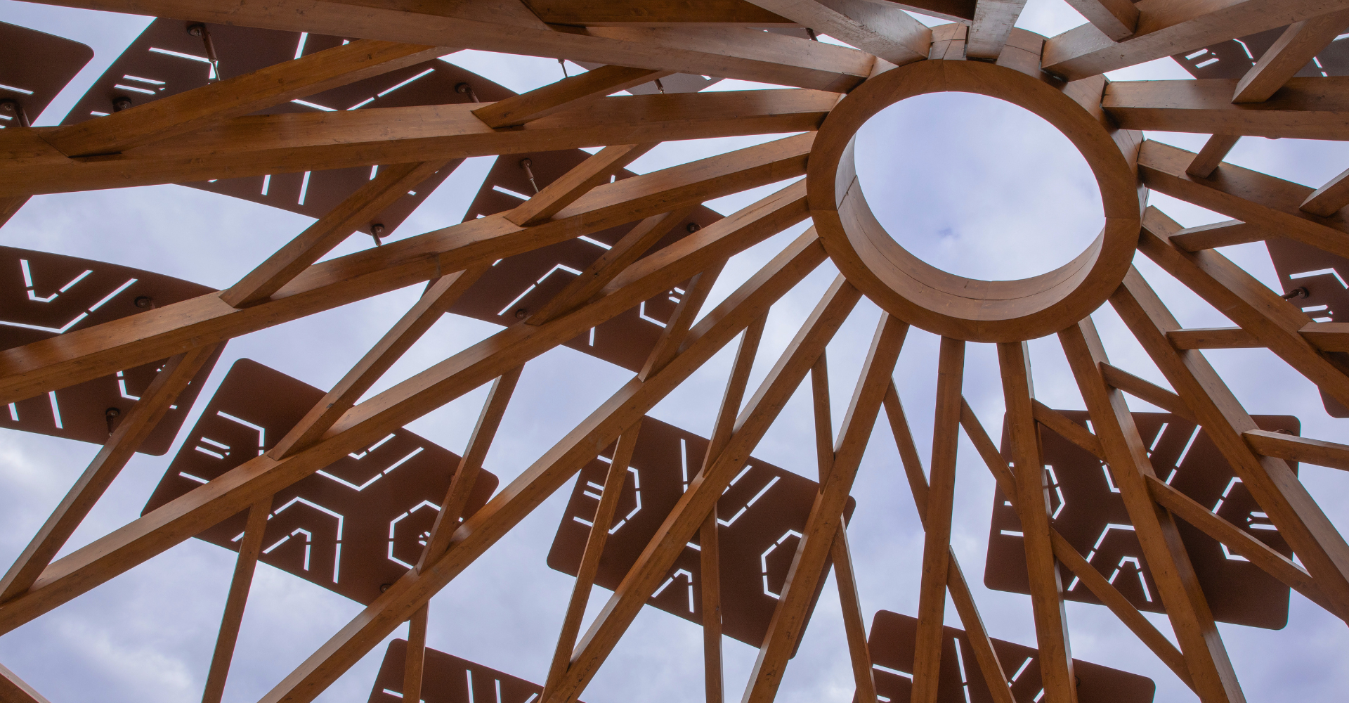 Wood arbour with light shining through